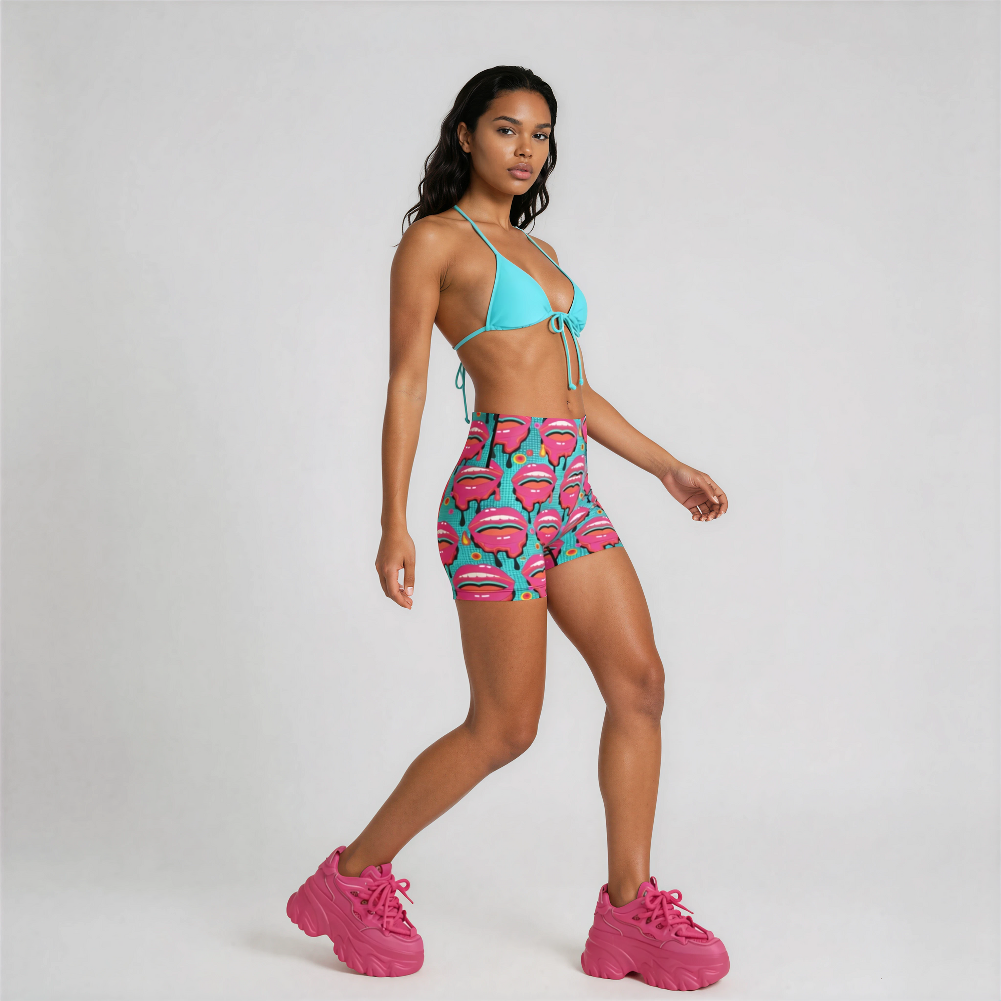 Actice view of the Lipsy Micro Shorts on female model in studio