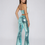 Thumbnail: Back view of aqua sequin two-piece set with high-waisted flare trousers in studio