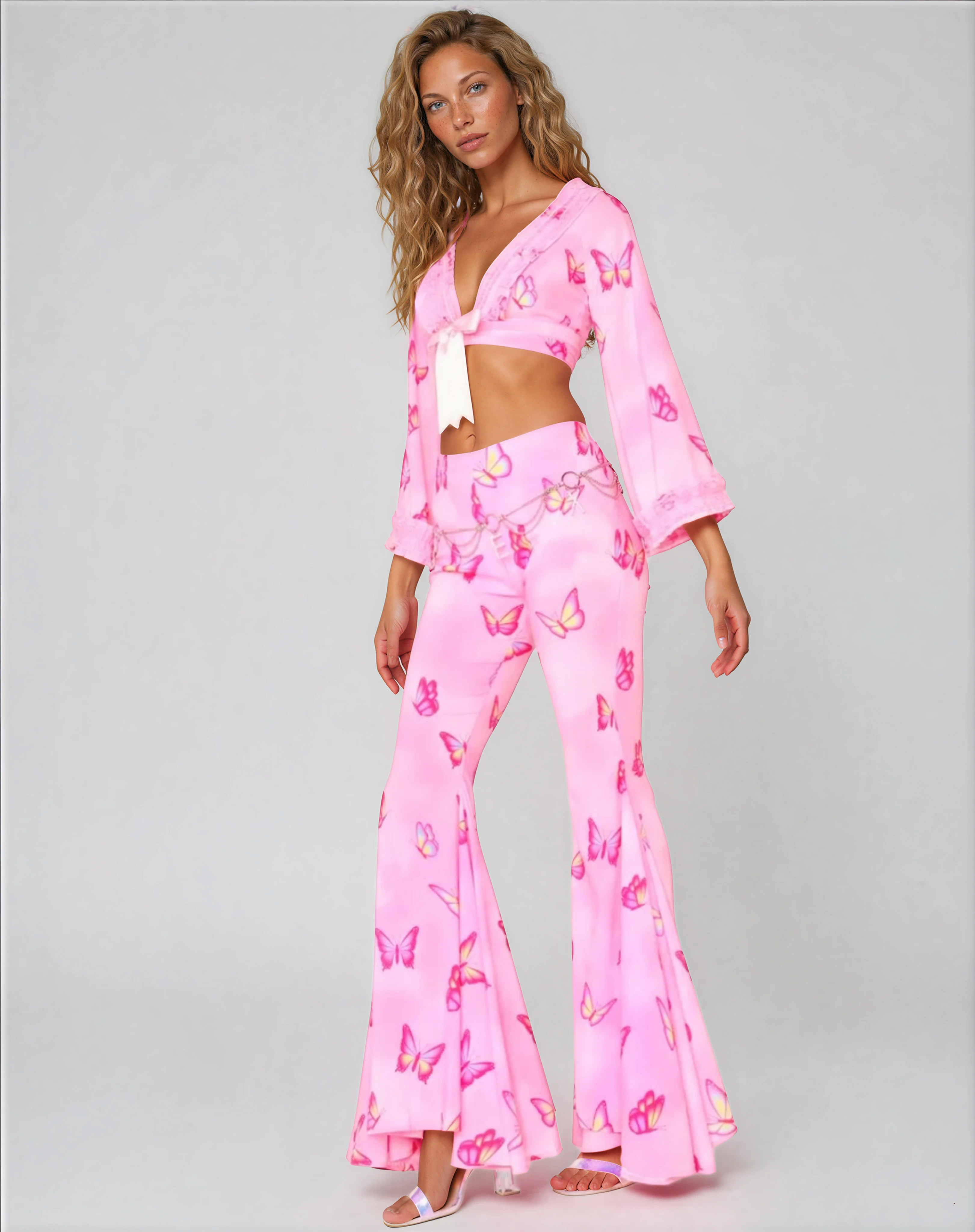 Side view of Butterfly mega flared pants on model, styled with matching top