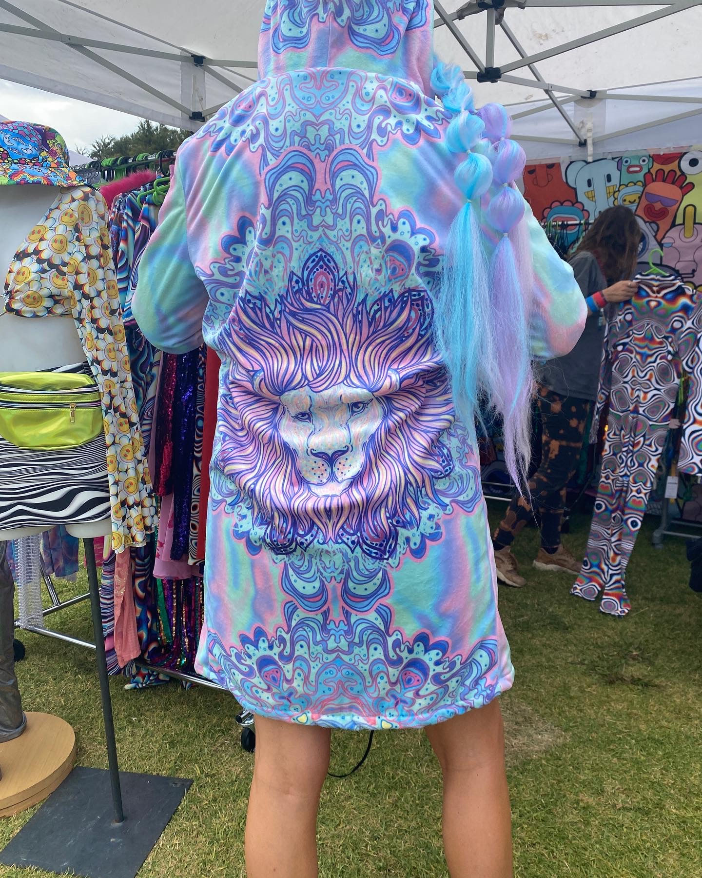 Lion spirit animal rave coat, back view, closeup, lifestyle, woman at festival
