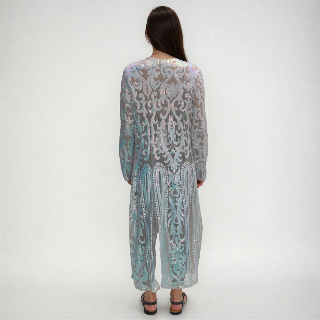 Back view of mother of pearl iridescent sequin robe on model in studio