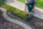 Landscape Gardener Laying Turf For New Lawn.jpg