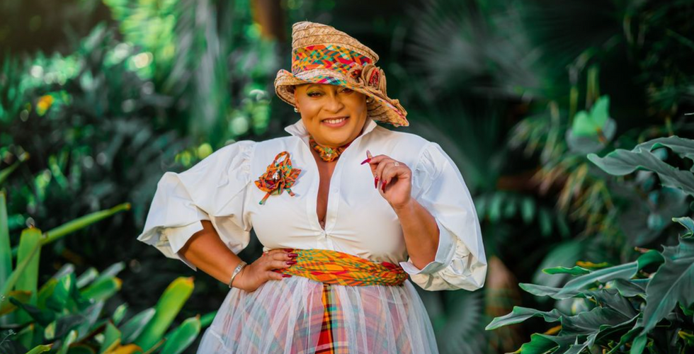 Renee Edwards, entrepreneur and advocate for Antiguan culture, proudly displays her stylish interpretation of traditional madras attire, reflecting the vibrancy of Antiguan identity.