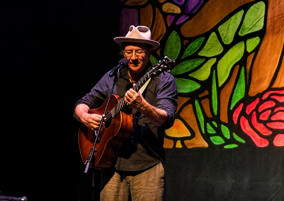 Gregory Page playing guitar