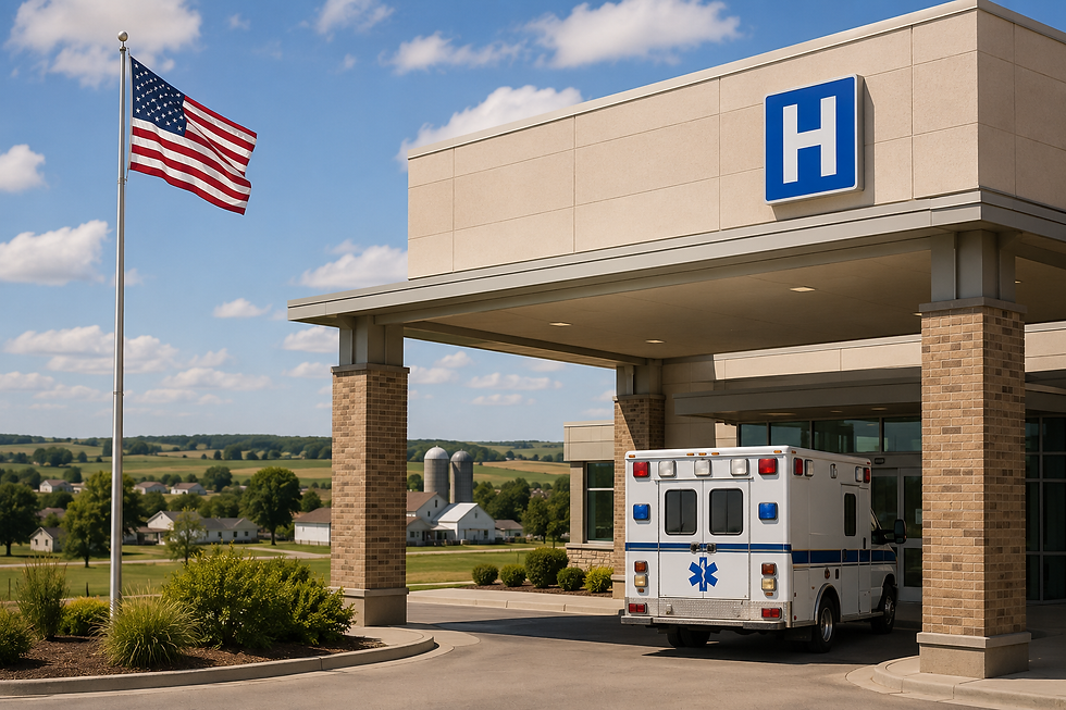 Ambulancia frente a un hospital con señal azul H y bandera de EE. UU.; cielo despejado y paisaje rural al fondo.