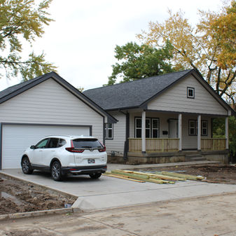 Two homes and the retaining wall in the backyard