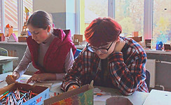 a group of people sitting at a table wor