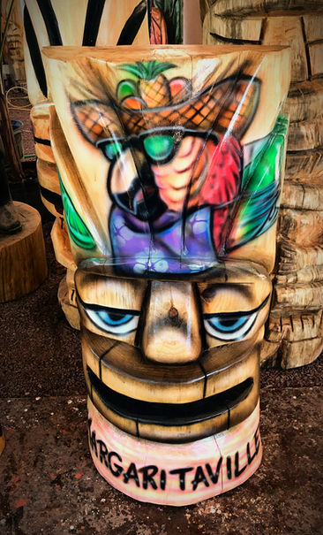 Tiki Murph carved palm half tiki with airbrush parrot and Margaritaville.