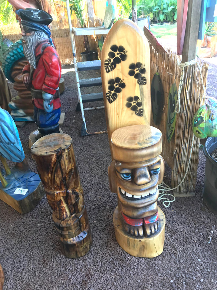 Tiki Murph white pine chainsaw carved tiki man surfer dude with surfboard