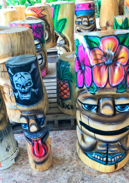 Tiki Murph chainsaw carved white pine pirate and tiki with floral design