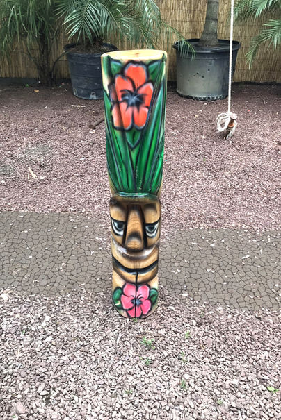 Tiki Murph chainsaw carved white pine floral and greens tiki.