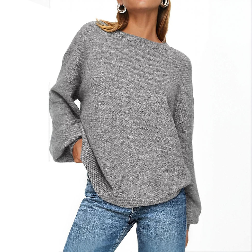 Woman wears comfortable grey knit crewneck sweater with blue jeans.