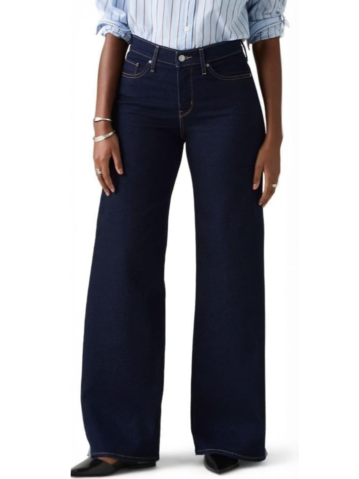 Person wearing dark wash wide-leg jeans and a striped shirt.