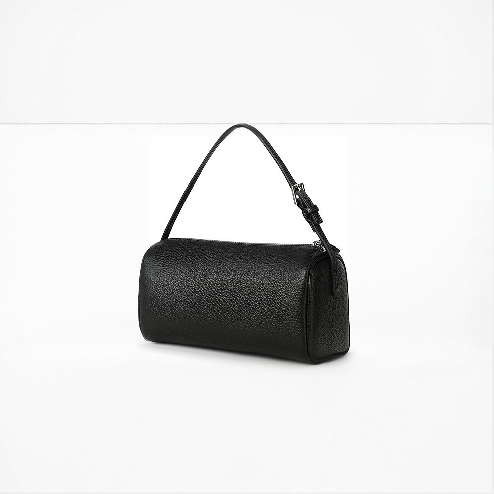 Black cylindrical leather handbag with shoulder strap on white background.