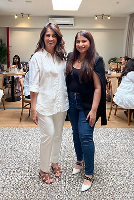 madiha and zainab standing together