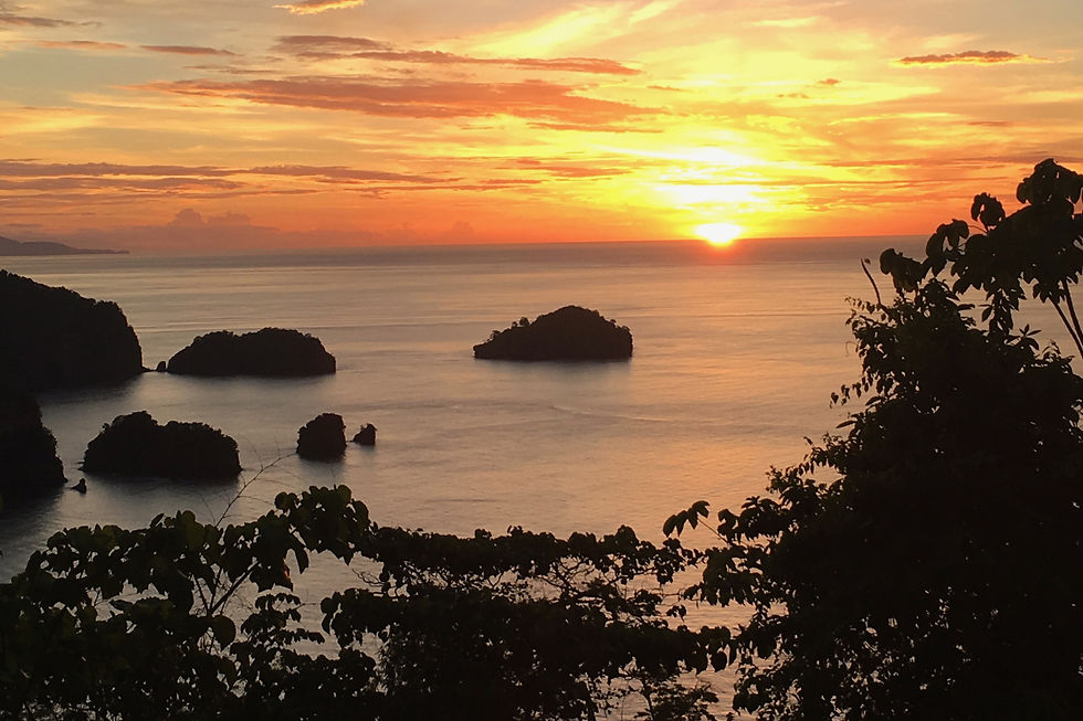 Stunning sunset in Tobago overlooking the ocean at a hilltop lookot point