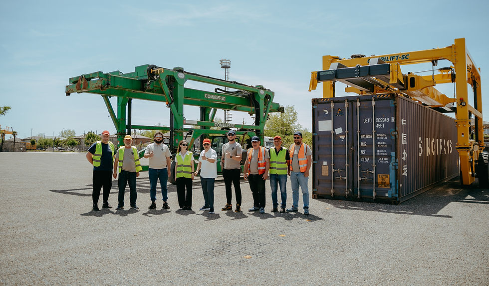 PLP Terminal Team on the terminal yard in front of Combilift straddle carriers and a cargo container