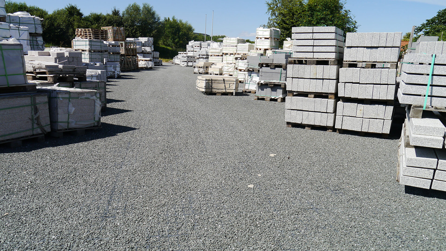 Pallets with construction materials on the Ecoraster paved ground