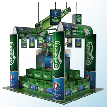 A large, multi-tiered display stand prominently featuring the Carlsberg beer products.