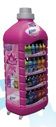 A large, pink Lenor fabric softener display unit with multiple shelves showcasing a wide variety of Lenor product sizes and scents.