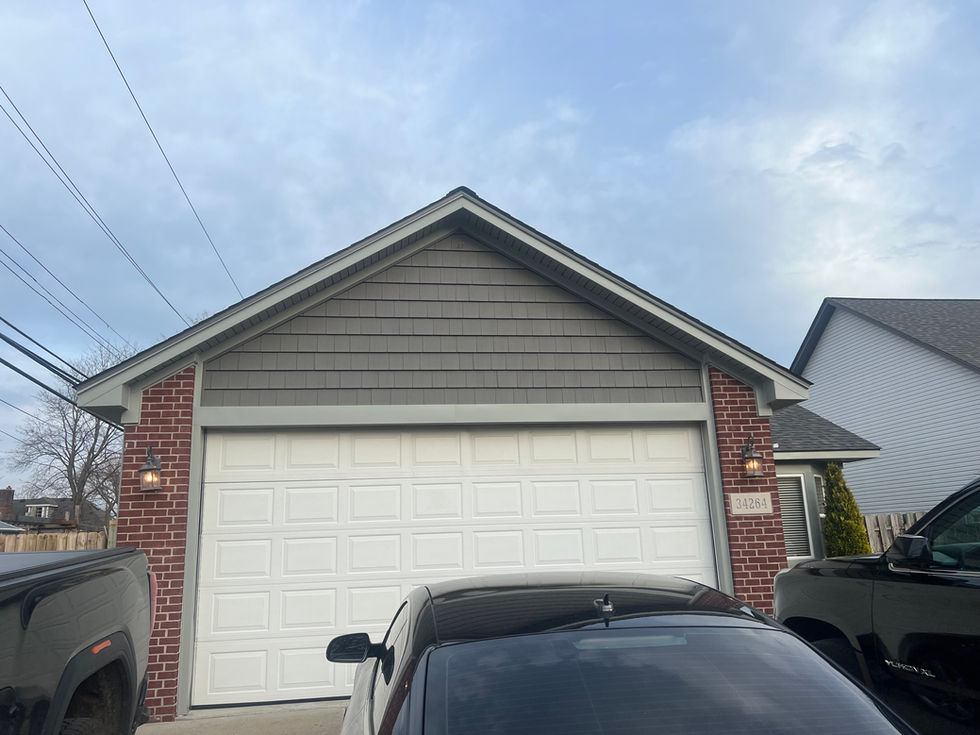 Picture of new vinyl cedar shake installed on front of home in Clinton Township Michigan