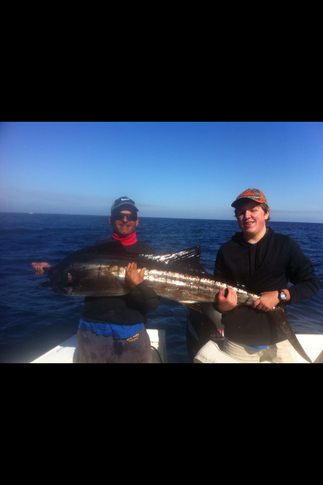 ZACH WITH FIRST SAILFISH