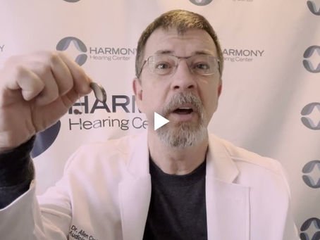 Dr. Allen Craig reviewing Starkey Genesis AI hearing aids at Harmony Hearing Center, highlighting improved speech clarity, natural sound, and longer battery life.