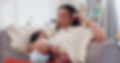 mom touching head in frustration holds baby