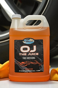 OJ The Juice Tire Dressing With a Tire in The Background