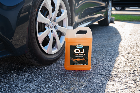 OJ The Juice Tire Dressing In Front of a Tire