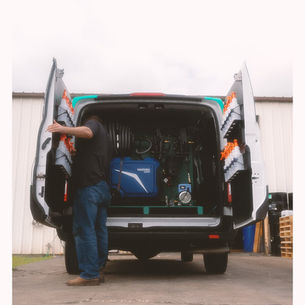 Custom detailing van interior with organized equipment and storage