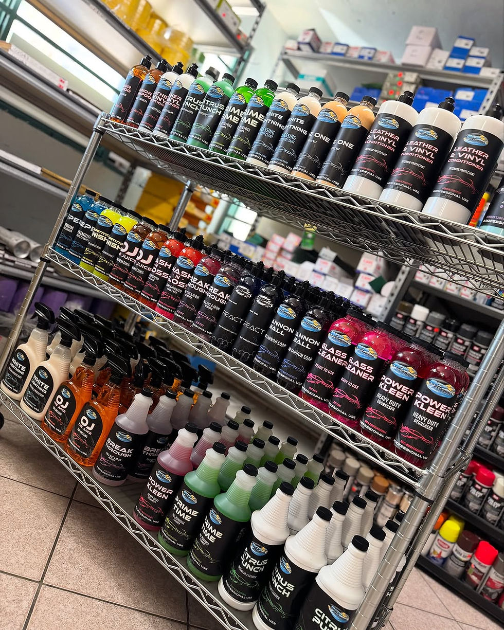 Close-up view of car detailing products arranged on a shelf at Detail Express Distributors