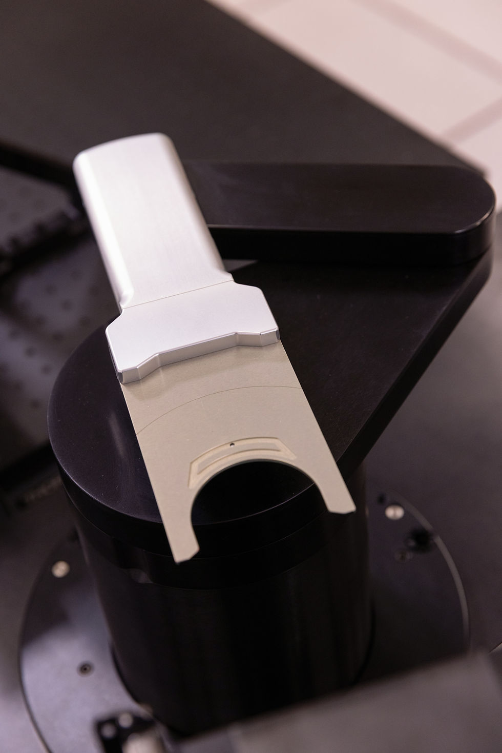 Precision-engineered wafer handling end effector mounted on a semiconductor robotic arm, designed for secure, contamination-free wafer transfer in automated cleanroom environments.