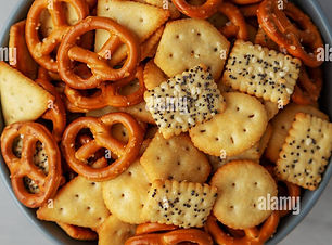 homemade-party-snack-mix-with-crackers-and-pretzels-in-a-bowl-top-view-flat-lay-overhead-f