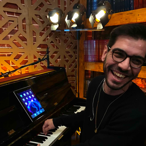 Sertan İpek composer working in music studio