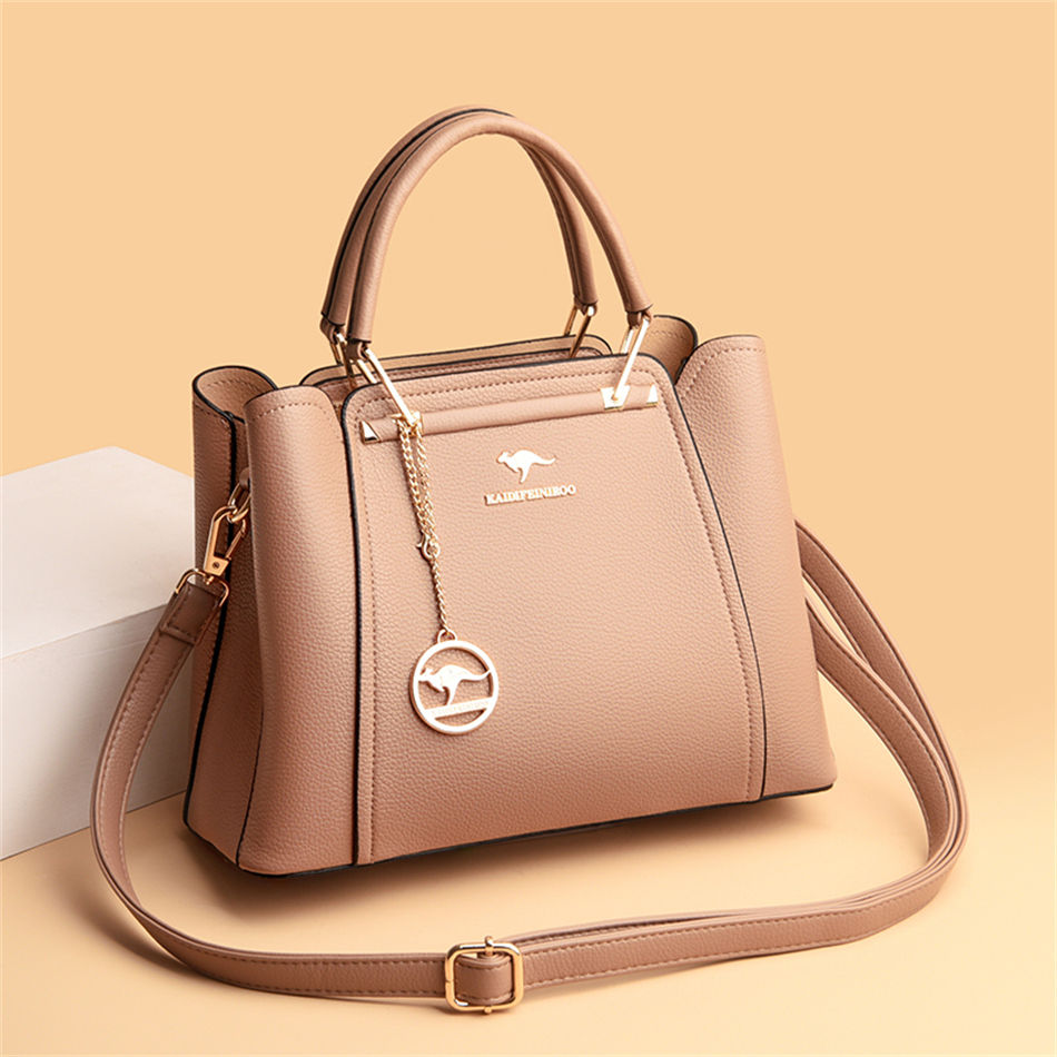 Thumbnail: “Beige structured leather handbag with top handles and adjustable shoulder strap, elegant minimalist bag for everyday use”