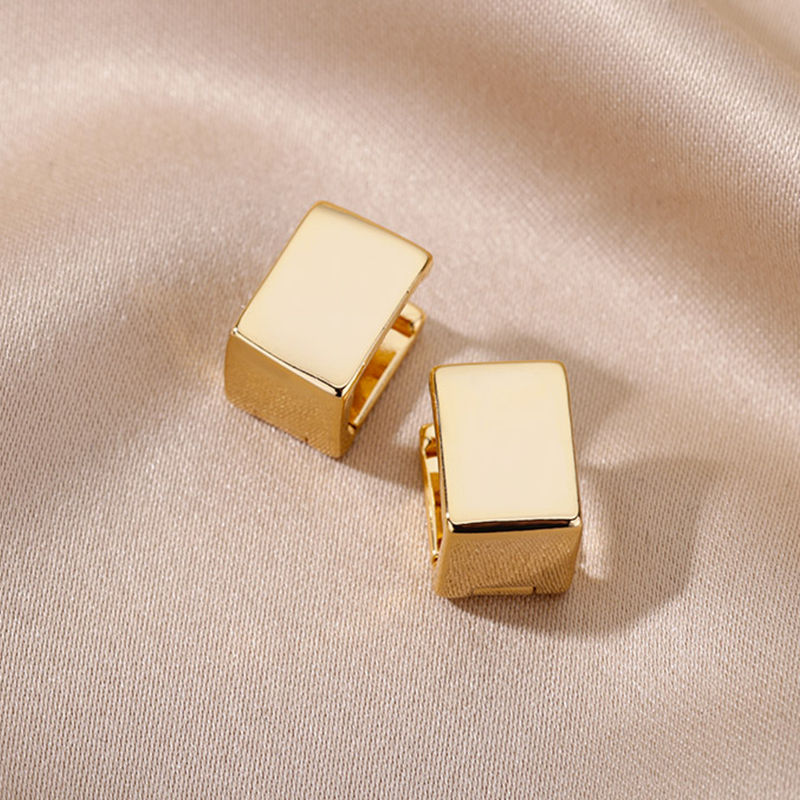 “Gold geometric stud earrings with smooth polished finish, minimalist modern jewellery for elegant everyday style”
