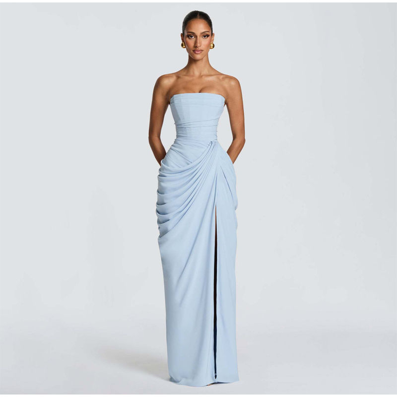 Thumbnail: "Woman wearing a strapless blue evening dress with a high slit, showcasing an elegant and sophisticated look."