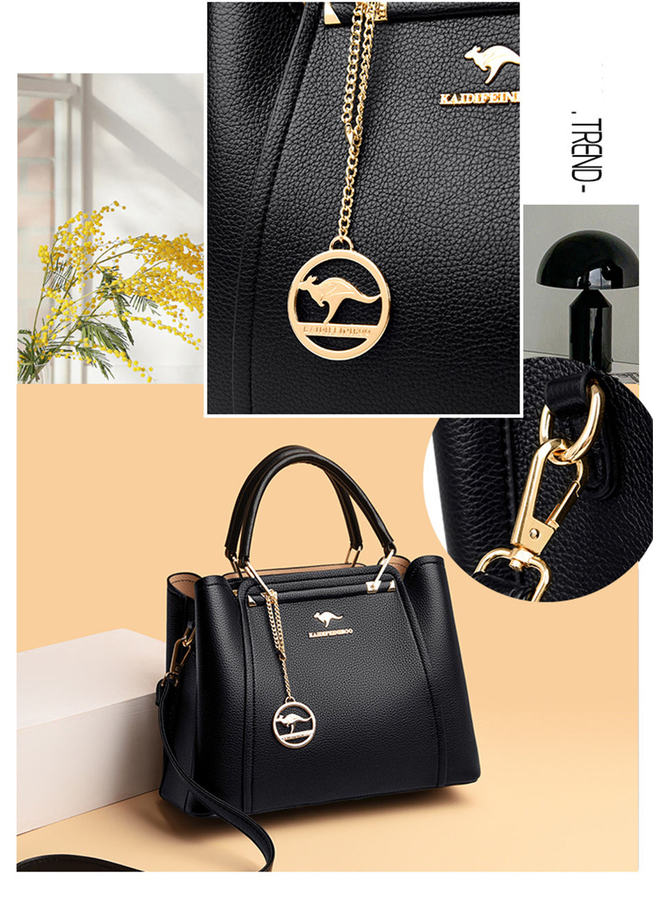 Thumbnail: “Black structured leather handbag with top handles and gold hardware, worn by woman, elegant and sophisticated everyday bag”