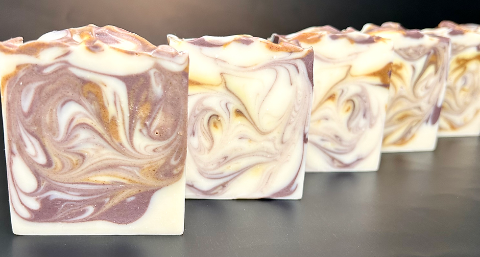 Lemon and lavender essential oil scented artisan coconut milk bar soap coloured with purple brazilian clay and yellow turmeric powder 