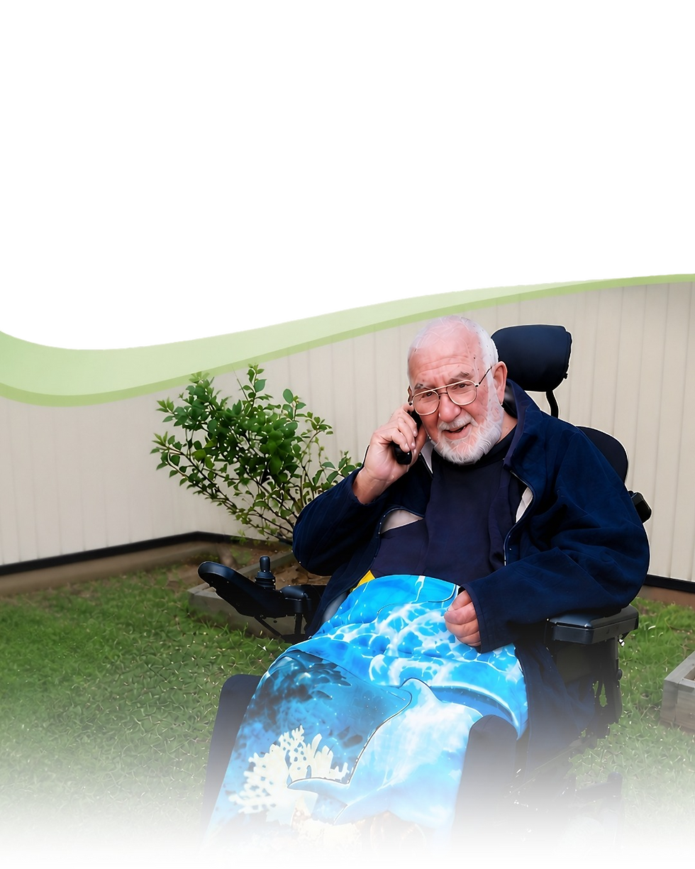 Photo of a NDIS client happy at home