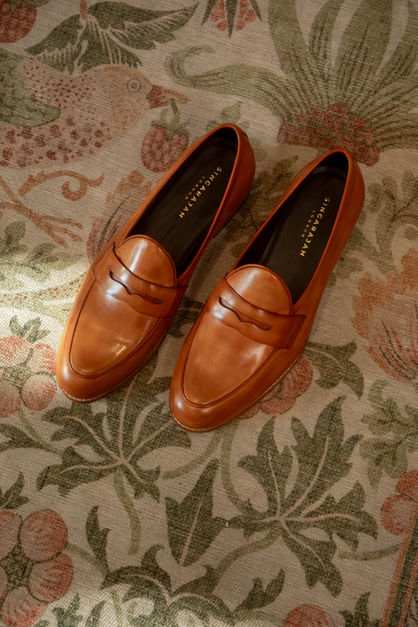 Handcrafted leather loafers showcasing refined detailing and a polished finish, designed for timeless elegance and comfort.