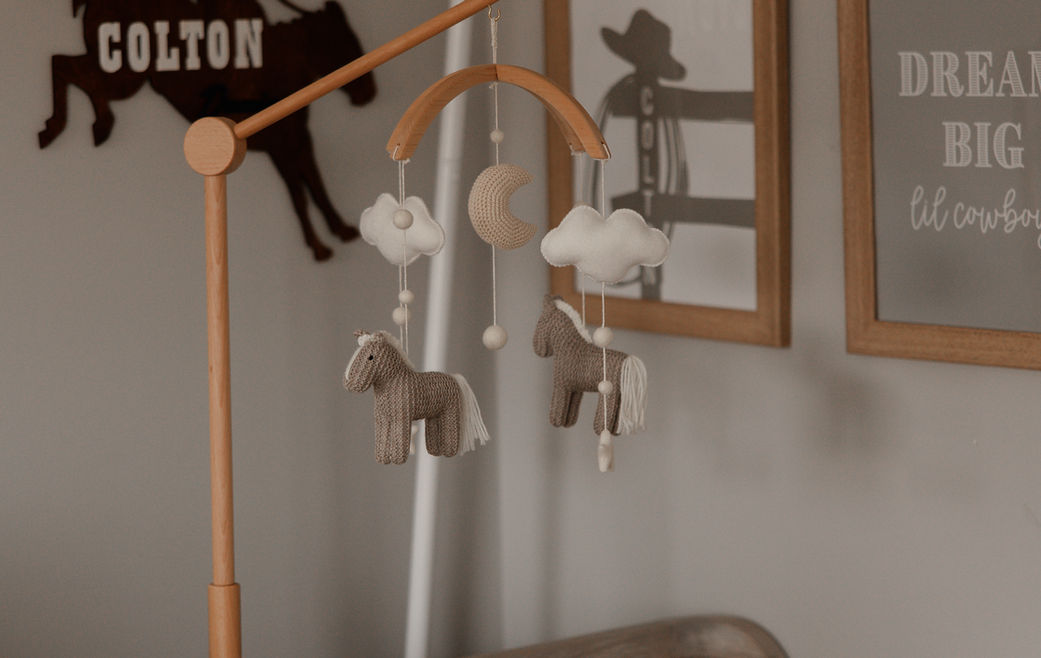 nursery crib with mobile decor Baltimore Maryland newborn photography