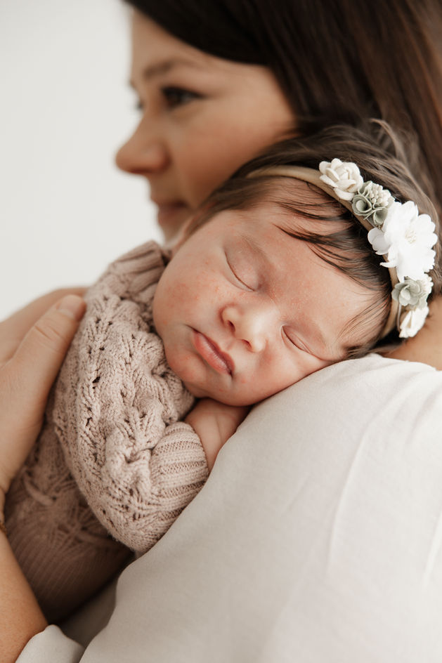 newborn baby girl sleeping on parent shoulder Baltimore Maryland infant photography