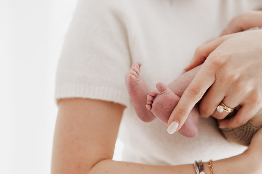 newborn baby feet detail parent hands Baltimore Maryland infant photography