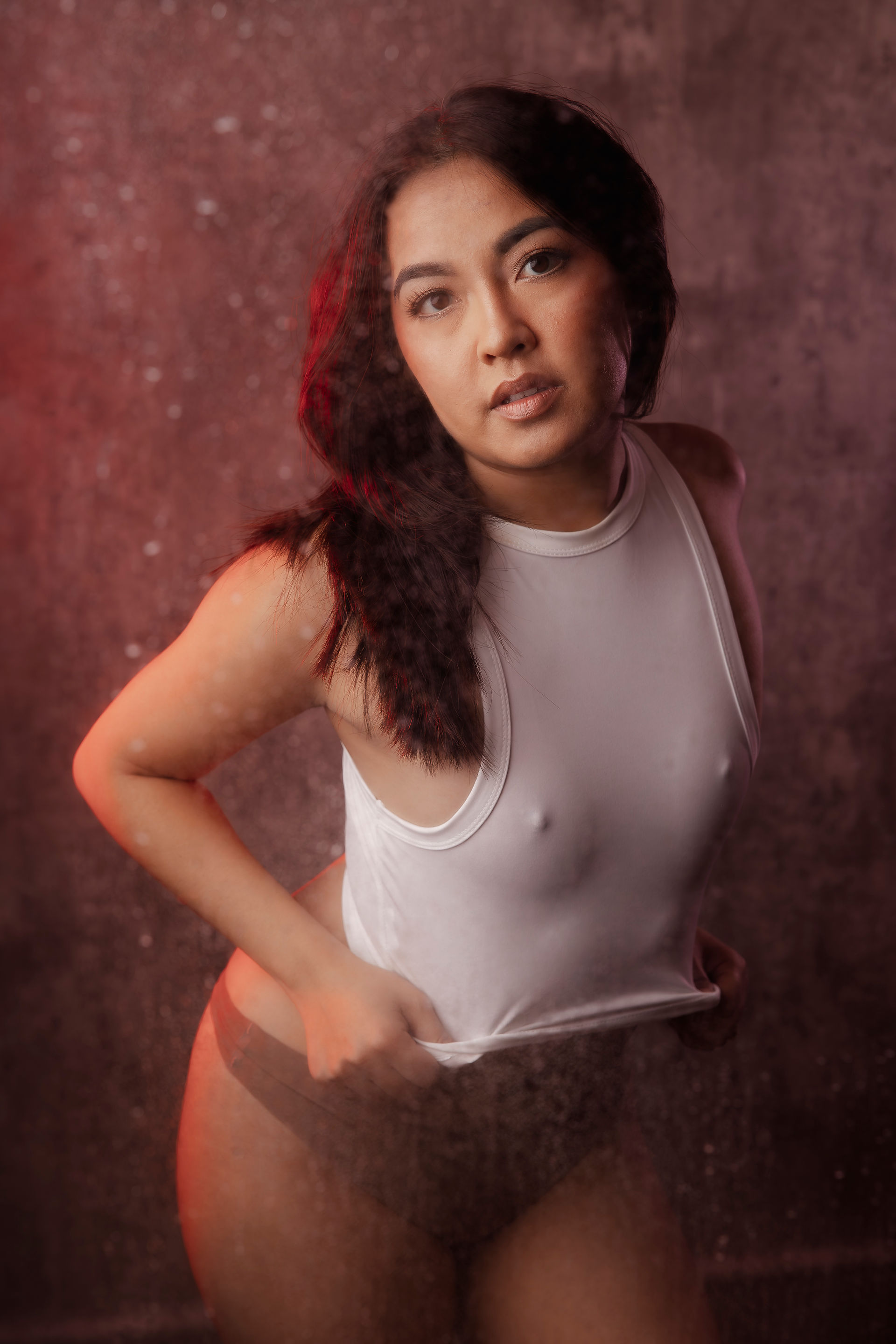 Washington DC boudoir portrait of a woman in lingerie sitting on a couch