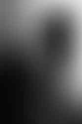 Baltimore boudoir photography image of a woman in lingerie with natural window light