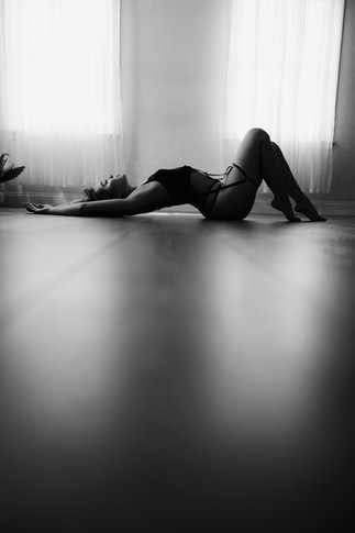 Boudoir photo of a woman in lingerie posing in a private studio in Baltimore County
