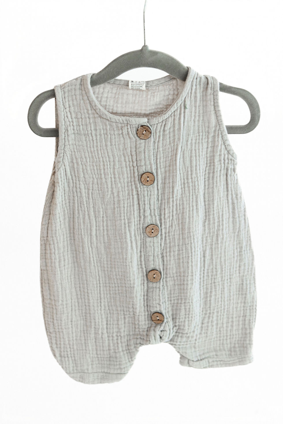 Button-front rompers in soft neutral tones for Maryland one year sessions. Classic styling with a cl