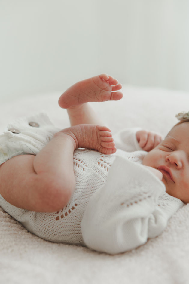 newborn baby stretching on blanket Baltimore Maryland newborn photography